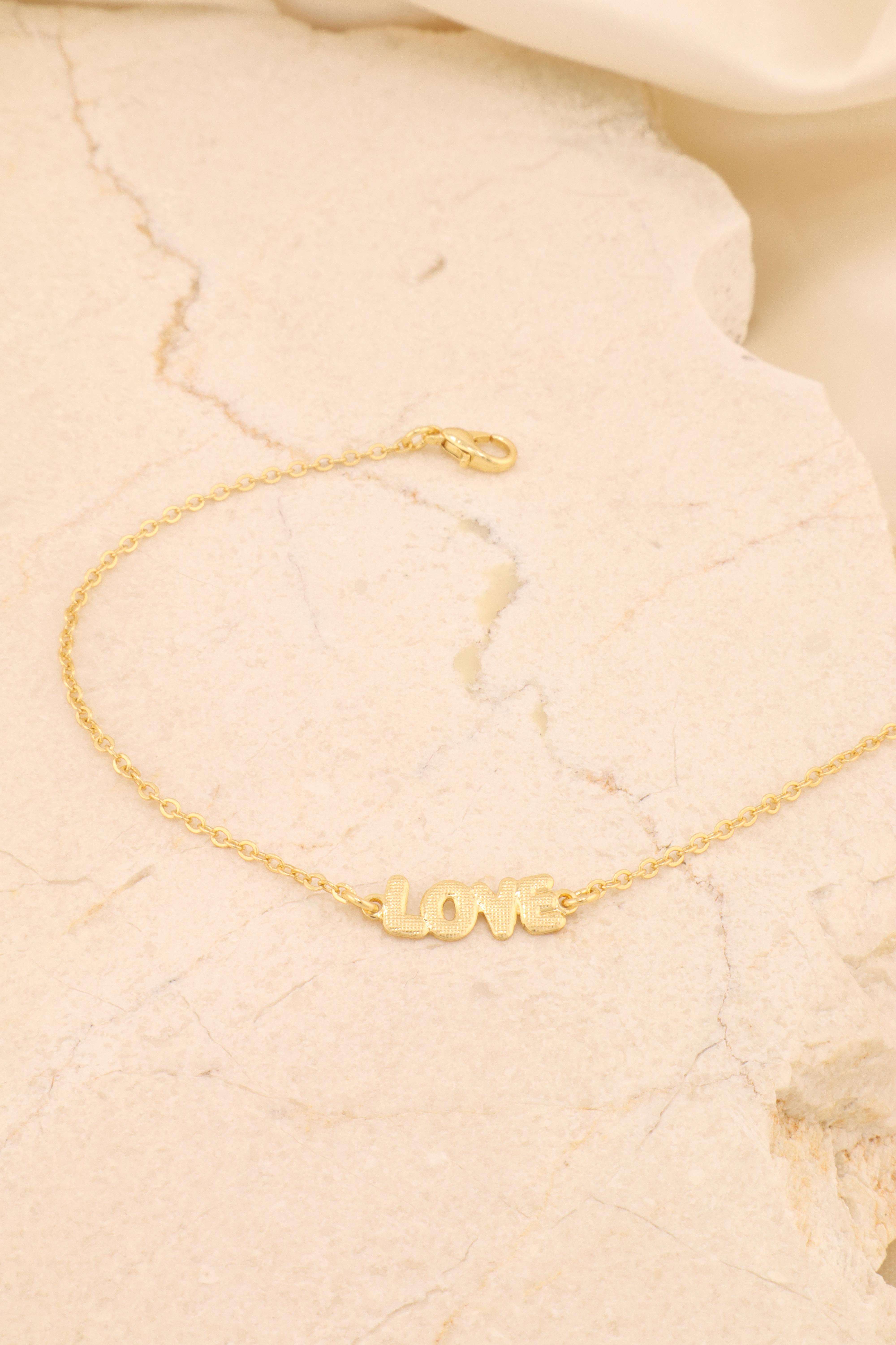 TORNOZ.  CORRENTE AMERICANA COM PINGENTE LOVE